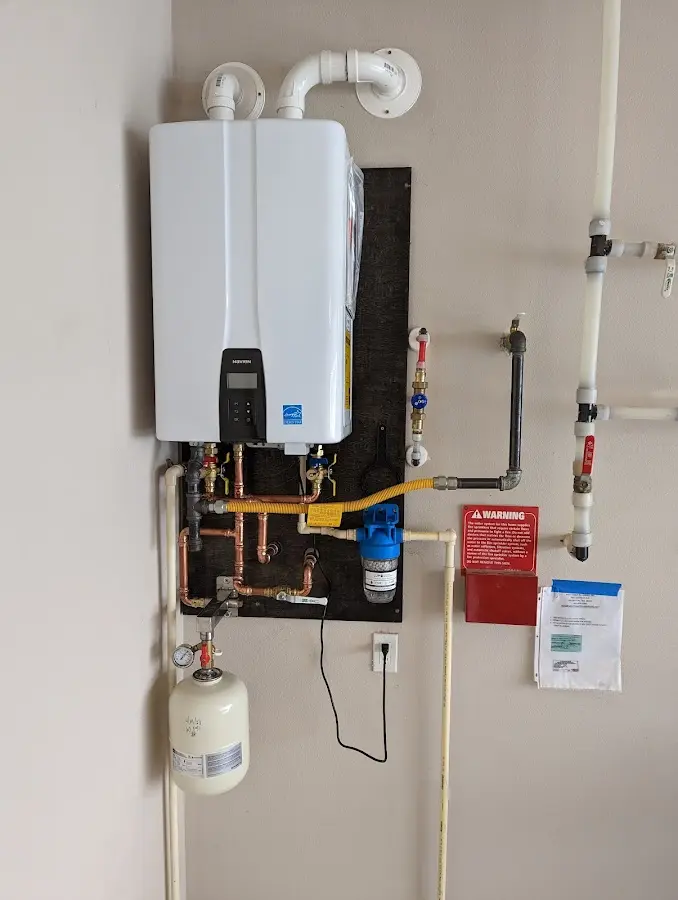 Professional plumber installing copper piping in a South Brooksville home